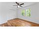 Bright bedroom showcasing hardwood floors, ceiling fan, closet and natural light at 1047 Winding Branch Ct, Atlanta, GA 30338