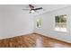 Bright bedroom showcasing hardwood floors, ceiling fan and great natural light at 1047 Winding Branch Ct, Atlanta, GA 30338