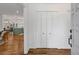 Bright foyer with hardwood floors, a closet, and view into the open-concept living space at 1047 Winding Branch Ct, Atlanta, GA 30338
