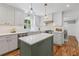 Bright kitchen features a center island, stainless steel appliances, and stylish cabinetry at 1047 Winding Branch Ct, Atlanta, GA 30338