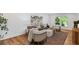 Bright living room showcasing hardwood floors, comfortable seating, and stylish decor at 1047 Winding Branch Ct, Atlanta, GA 30338