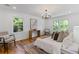 Cozy main bedroom featuring natural light, hardwood floors, and stylish decor at 1047 Winding Branch Ct, Atlanta, GA 30338