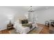 This main bedroom showcases hardwood floors, a decorative rug, and neutral colors at 1047 Winding Branch Ct, Atlanta, GA 30338