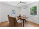 This home office features neutral paint, hardwood floors, and natural light at 1047 Winding Branch Ct, Atlanta, GA 30338