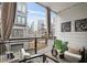 Private balcony with cozy seating and outdoor decor with views of the surrounding neighborhood at 1050 Stacks Ave # 1507, Atlanta, GA 30315