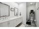 Modern bathroom features dual sinks, decorative tile flooring, and glass enclosed shower at 1050 Stacks Ave # 1507, Atlanta, GA 30315