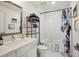 Well-lit bathroom with vanity, stylish mirror and decorative shower curtain at 1050 Stacks Ave # 1507, Atlanta, GA 30315