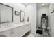 Bathroom featuring double sink vanity, decorative tile flooring, and walk-in shower at 1050 Stacks Ave # 1507, Atlanta, GA 30315