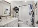 Modern bathroom features a white vanity, and a shower with a colorful shower curtain at 1050 Stacks Ave # 1507, Atlanta, GA 30315