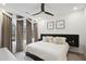 Bright bedroom with neutral decor, modern ceiling fan, and abundant natural light from the large window at 1050 Stacks Ave # 1507, Atlanta, GA 30315