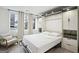 Stylish bedroom offers a murphy bed, bright windows, and built in shelving at 1050 Stacks Ave # 1507, Atlanta, GA 30315