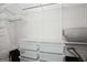 Spacious closet includes ample shelving, containers and hanging storage at 1050 Stacks Ave # 1507, Atlanta, GA 30315