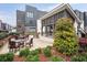 Modern apartment complex featuring a community courtyard with outdoor seating and lush landscaping at 1050 Stacks Ave # 1507, Atlanta, GA 30315