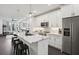 Modern kitchen featuring stainless steel appliances, marble countertops, pendant lighting and a peninsula with bar stool seating at 1050 Stacks Ave # 1507, Atlanta, GA 30315