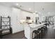Bright kitchen with white cabinetry, stainless steel appliances, a marble countertop island, and bar stool seating at 1050 Stacks Ave # 1507, Atlanta, GA 30315