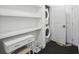 Efficient laundry room featuring stackable washer and dryer units plus storage at 1050 Stacks Ave # 1507, Atlanta, GA 30315