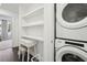 Bright laundry room with modern stackable washer and dryer units at 1050 Stacks Ave # 1507, Atlanta, GA 30315