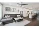 Living room adjacent to a modern kitchen with island and stainless appliances at 1050 Stacks Ave # 1507, Atlanta, GA 30315