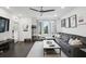 Living room with large windows, hardwood flooring, comfortable furnishings, and modern decor at 1050 Stacks Ave # 1507, Atlanta, GA 30315