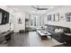Open-concept living room with a large sectional couch and a modern entertainment center at 1050 Stacks Ave # 1507, Atlanta, GA 30315