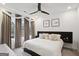 Bedroom with a king bed, modern decor, and large window with city view at 1050 Stacks Ave # 1507, Atlanta, GA 30315