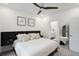 Bright main bedroom features a ceiling fan, ensuite bathroom, and minimalist decor at 1050 Stacks Ave # 1507, Atlanta, GA 30315