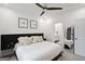 Bedroom featuring a modern bed, neutral decor, and access to the ensuite bathroom at 1050 Stacks Ave # 1507, Atlanta, GA 30315