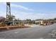 A vibrant street featuring commercial spaces and an iconic tower under a clear blue sky at 1050 Stacks Ave # 1507, Atlanta, GA 30315