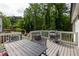 Outdoor deck featuring a BBQ grill and an outdoor dining area at 1711 Terry Mill Se Rd, Atlanta, GA 30316