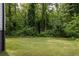 Lush, expansive backyard surrounded by mature trees, creating a serene and private outdoor retreat at 1711 Terry Mill Se Rd, Atlanta, GA 30316