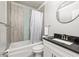 Bathroom featuring modern fixtures, tub with shower curtain, and granite vanity counter at 1711 Terry Mill Se Rd, Atlanta, GA 30316