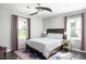 Comfortable bedroom with natural light, ceiling fan, dark wood furniture and colorful rug at 1711 Terry Mill Se Rd, Atlanta, GA 30316