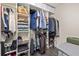 Walk-in closet with built-in shelves and hanging rods provides ample storage space at 1711 Terry Mill Se Rd, Atlanta, GA 30316