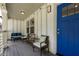 Inviting front porch with seating, a bright blue door, stylish lighting, and a relaxing outdoor space at 1711 Terry Mill Se Rd, Atlanta, GA 30316