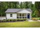 Charming home with a covered porch, blue front door, and a well-maintained lawn and landscaping at 1711 Terry Mill Se Rd, Atlanta, GA 30316