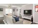 Comfortable living room with modern decor, an open floor plan, and plenty of natural light from large windows at 1711 Terry Mill Se Rd, Atlanta, GA 30316