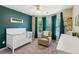 Bedroom featuring a crib, chair, and custom paint at 2267 Howell Farms Trl, Acworth, GA 30101
