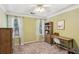 Bright bedroom featuring neutral paint, ceiling fan, and decor with great natural light at 2267 Howell Farms Trl, Acworth, GA 30101