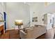 Open living room featuring a fireplace, hardwood floors, and high ceilings at 2267 Howell Farms Trl, Acworth, GA 30101