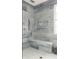 Modern glass enclosed shower with built-in bench and multiple shower heads at 2469 River Oak Dr, Decatur, GA 30033