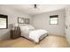Neutral bedroom with wood floors, ceiling fan, and a beautiful accent wall with decorative artwork at 2469 River Oak Dr, Decatur, GA 30033