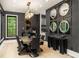 Elegant dining room features contemporary lighting, dark wallpaper, and modern table at 2469 River Oak Dr, Decatur, GA 30033