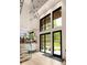 Bright foyer with high ceilings, modern lighting, an open staircase, and large windows at 2469 River Oak Dr, Decatur, GA 30033