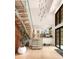 Bright foyer with an open staircase, modern chandelier, and view into the home's living spaces at 2469 River Oak Dr, Decatur, GA 30033