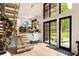 Bright foyer boasts an open staircase, large windows, and sleek, contemporary design at 2469 River Oak Dr, Decatur, GA 30033