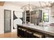 Bright kitchen featuring a marble top island, counter seating and modern stainless steel appliances at 2469 River Oak Dr, Decatur, GA 30033