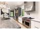 Bright kitchen featuring stainless steel appliances, modern cabinetry, and marble countertops at 2469 River Oak Dr, Decatur, GA 30033