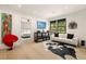 Modern living room with white sofa, artwork, and large windows for natural light at 2469 River Oak Dr, Decatur, GA 30033