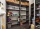 Organized pantry with wooden shelving, storage containers, and ample storage space at 2469 River Oak Dr, Decatur, GA 30033