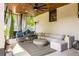 Covered patio with fireplace, outdoor kitchen, and comfortable seating area at 2469 River Oak Dr, Decatur, GA 30033